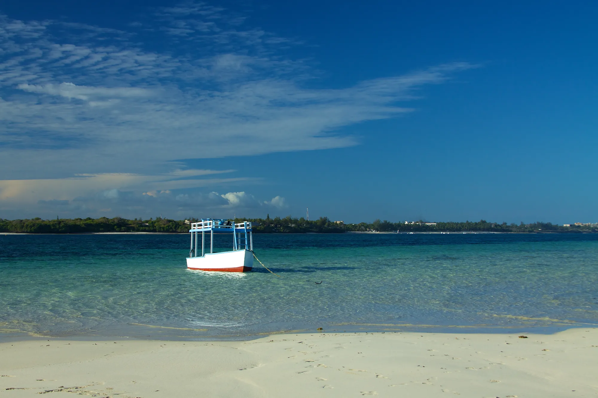 A traditional wooden dhow off the coast near Mombasa Marine National Park